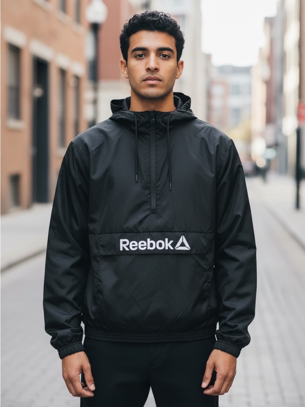 Never worn Reebok Black Hooded Windbreaker with Front Logo
